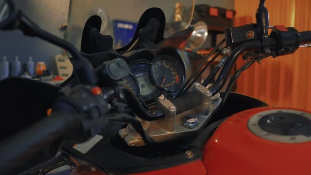 Handlebars of a motorcycle in a mechanical workshop