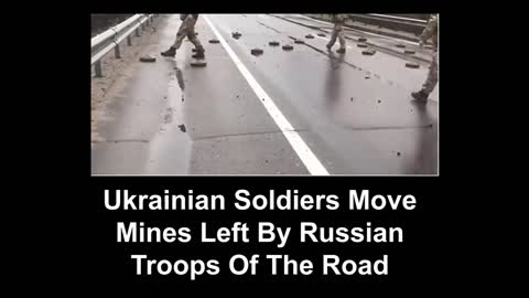 Ukrainian Soldiers Move Mines Left By Russian Troops Of The Road