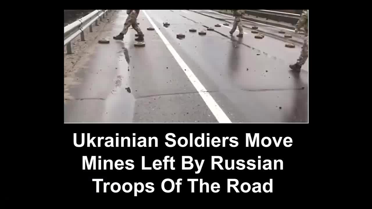 Ukrainian Soldiers Move Mines Left By Russian Troops Of The Road