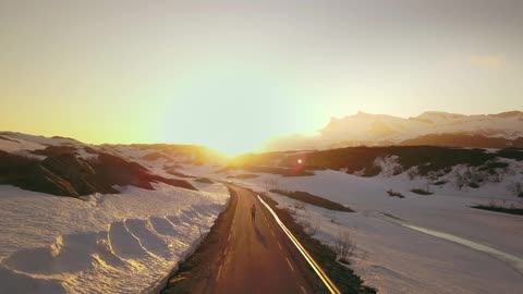Running in the morning in snowy mountains with Beautiful sunrise view