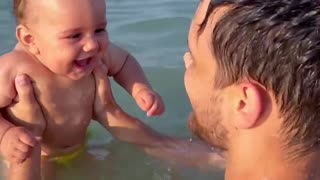 Beachgoing Baby Belly Laughing