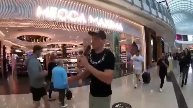 Group of Aussies sing. You can stick your covid vaccines up your ass down a shopping center in AUS