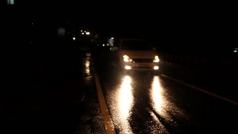 A car that runs on a rainy day.