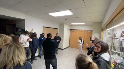 Hudsonville Parents Locked out of Board Meeting listen in Hallway