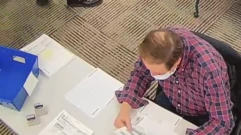 Election workers filling out ballots in Delaware, Pennsylvania