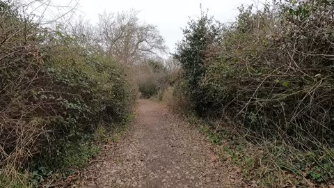 Hiking past holiday standing caravans to get to the coast