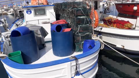 Fisherman boats with keepnets