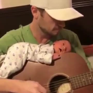 Cute baby sleeps on his father's guitar while he is playing the guitar🥰🥰🥰