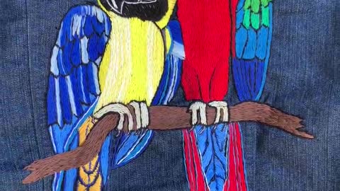 Hand embroidery macaw parrots