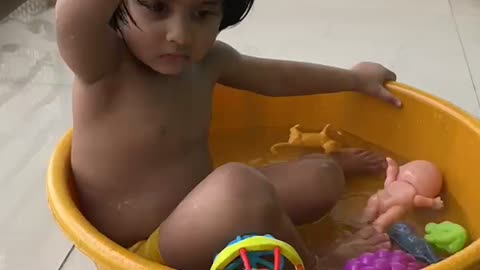 Cute baby enjoying bath (Timelapse)