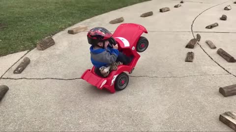 kid doing stunts by his car(funny video)