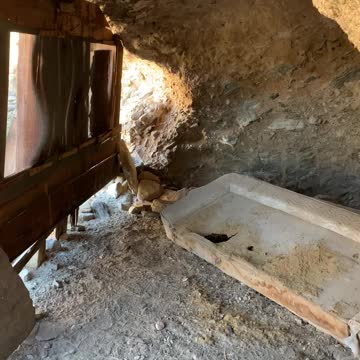 Very old homestead built into an overhand in Arizona