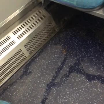 Wet dirty blue train seat