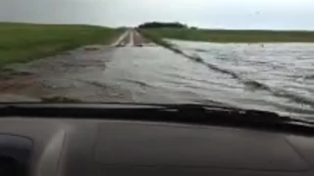 Man Drives Straight Through Flooded Road!