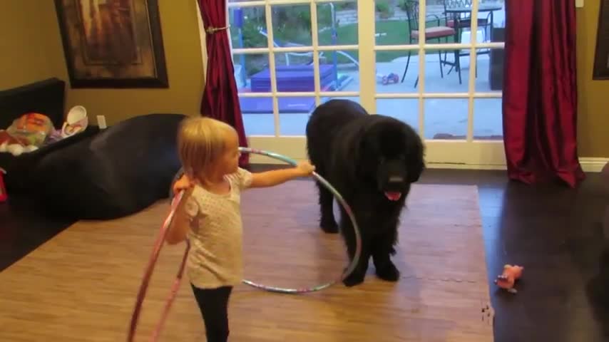 Toddler teach hula hoop to kiddo