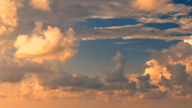 body of water under cloudy sky during sunset