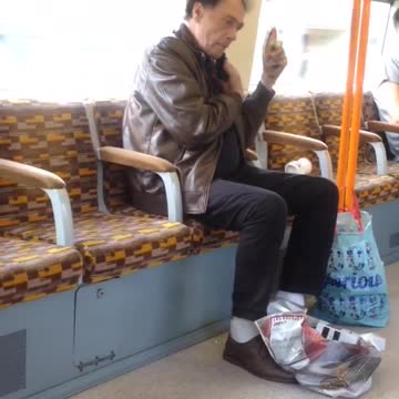 Man shaves mustache on bus ride
