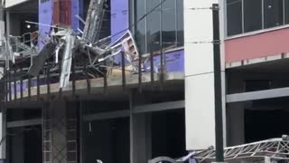 Hotel Collapse Showers Debris on Street