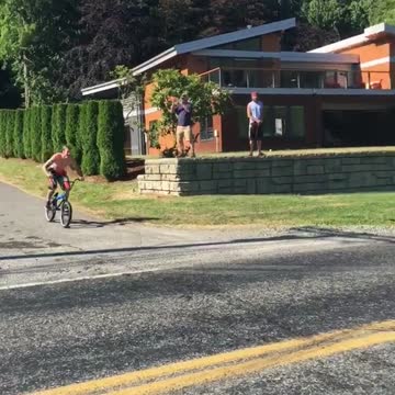 Guy bike speed down road runs into lake misses ramp