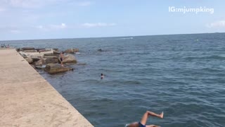 Guy blue speedo side flip into water fail