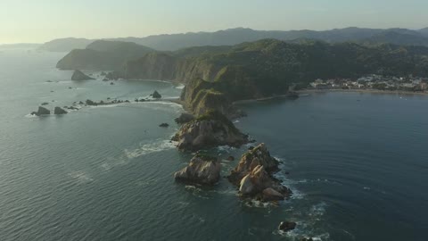 Relief on a coastline at sunset from above