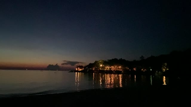 The Soft Waves In The Beach At Dusk