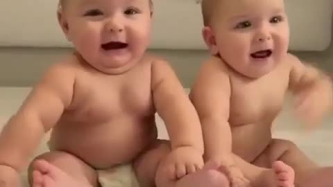 Cute two baby laughing