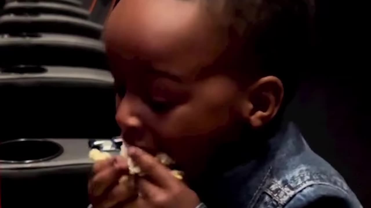 The intense way this kid eats popcorn at the movie theater is blowing our minds