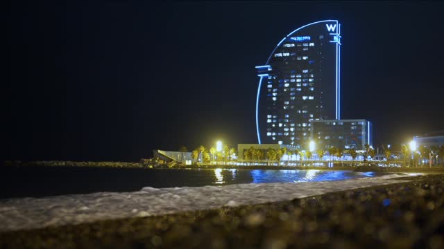 barcelona spain barcelona spain view of the hotel sail on the beach of barceloneta in night