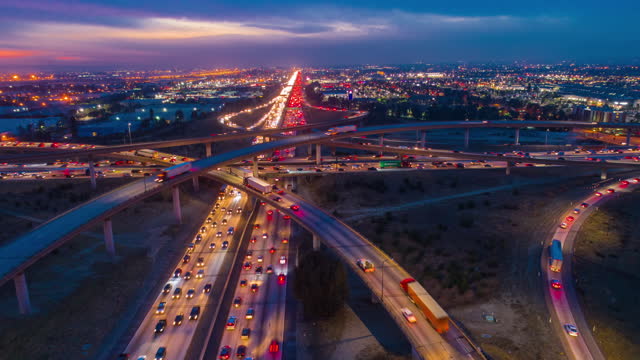 Urban aerial drone time lapse in motion or hyperlapse at night flying