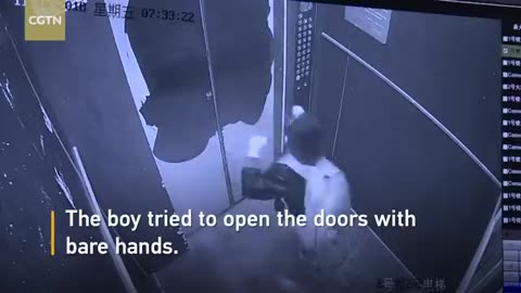 Boy uses umbrella to prevent elevator door from closing, causes free fall