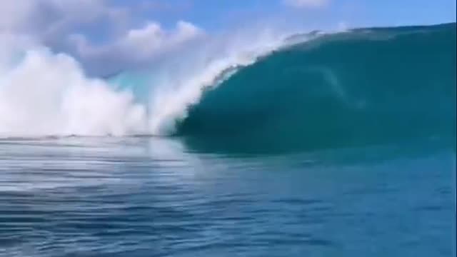 The thrill of a huge wave rolling in