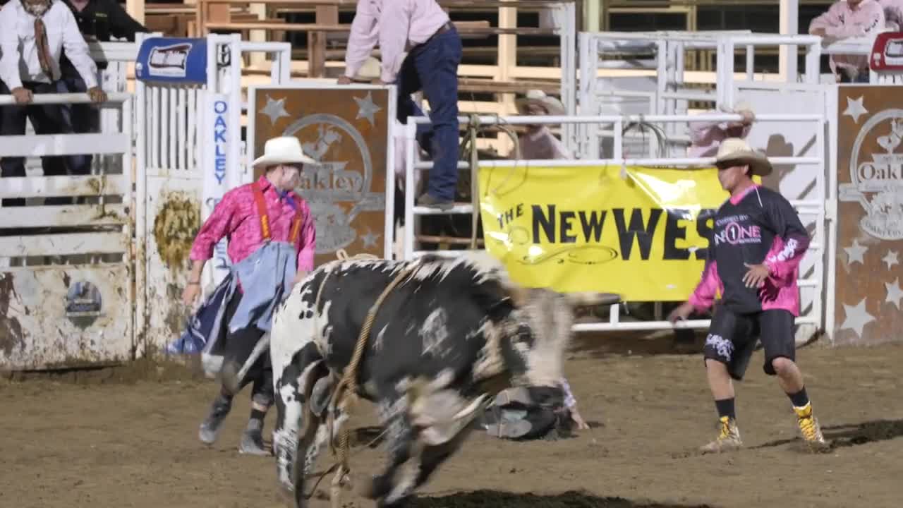 Editorial a cowboy riding a crazy bull at the PRCA Oakley rodeo slow motion