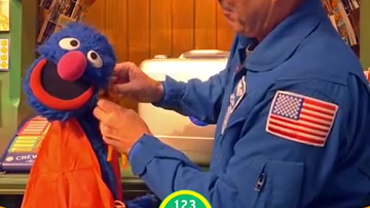 NASA Astronaut Returns Sesame Street Mementos Flown on Orion Spacecraft (Grover's cape)