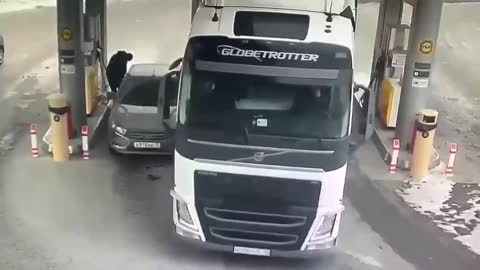 Man trying to protect his car to avoid getting crushed by a truck
