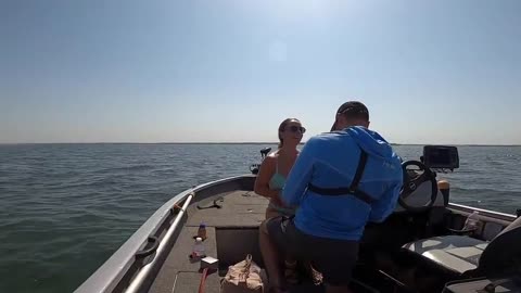 Man proposes to girlfriend as she reels in fish during boat trip in Texas