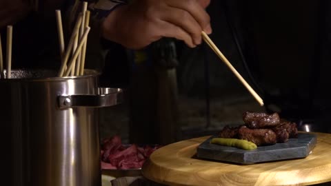 Grilled beef plated on the camping ground. 2