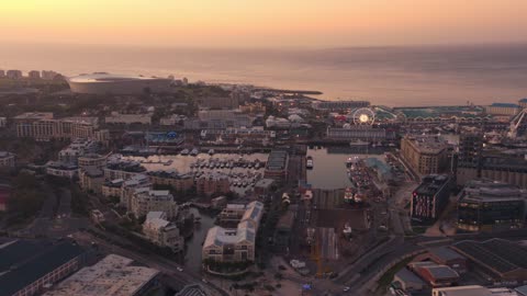 Aerial shots of seaside cities as night falls