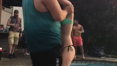 Girl thrown by big man into pool fail