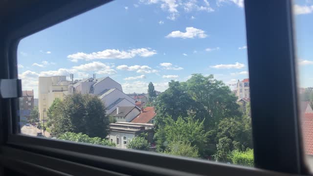 Admiring the sunny weather on the Parisian subway.