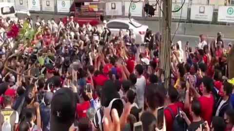 Thai police scuffle with protesters at demonstration against Myanmar coup.