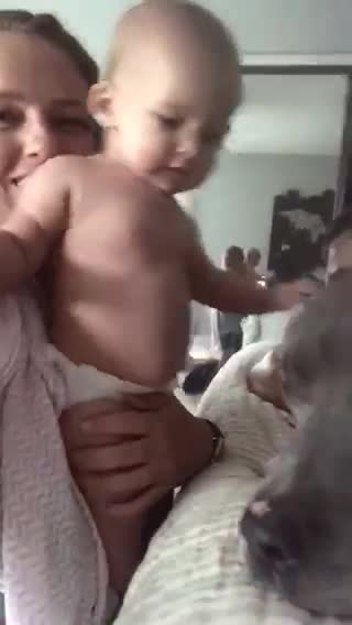 Baby attacked with kisses