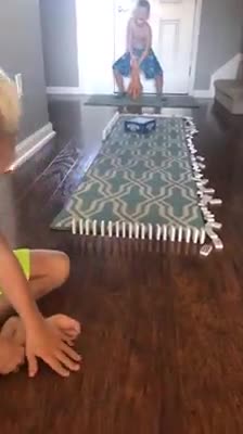 Dog Knocks Over Dominos When Mom Makes Kids Wait For Live Audience