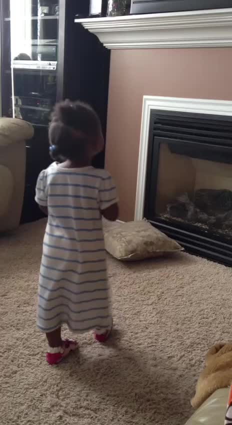 Baby girl imitating dancers
