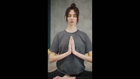 A Woman Doing Meditation In Lotus Position