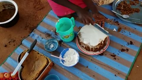 Baking my birthday cake in the village using sandVillage celebrations Part 2