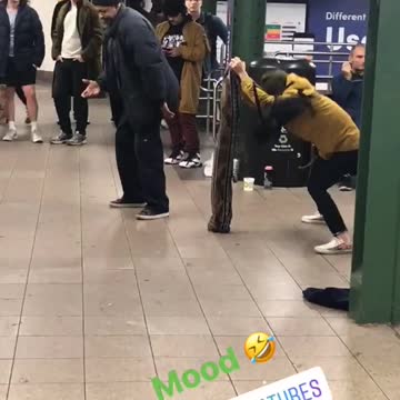 Woman in orange yellow jacket dancing