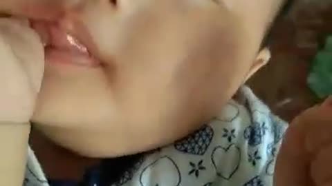 Thumb biting baby