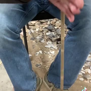 Drilling a hole in a rock by hand