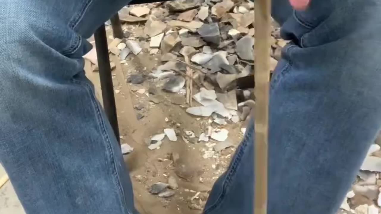 Drilling a hole in a rock by hand